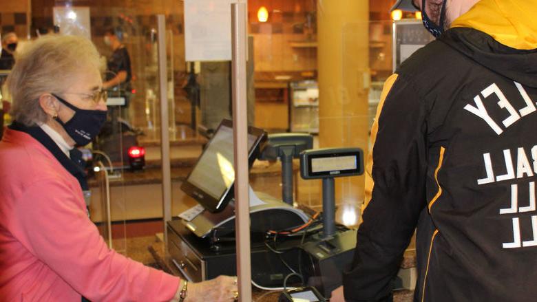 Port Sky cashier Theresa "Terry" Karcz helps a Penn State Altoona student "swipe out hunger" 